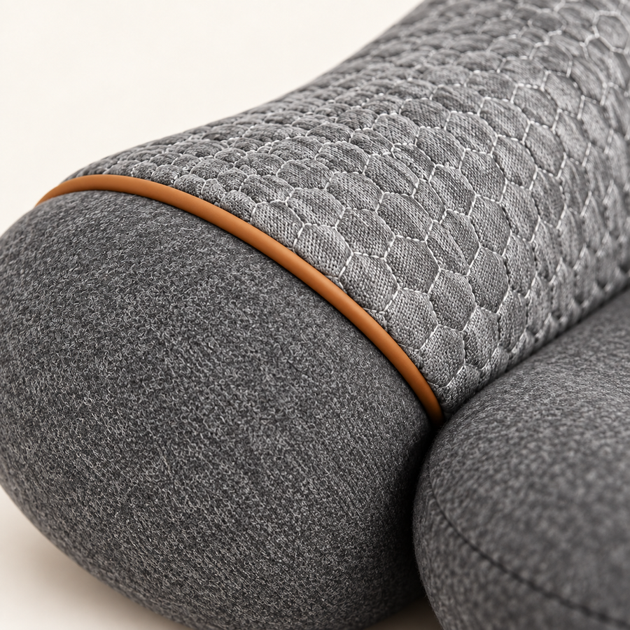 A closer look at the gray woven fabric, mesh surface and tan piping.
